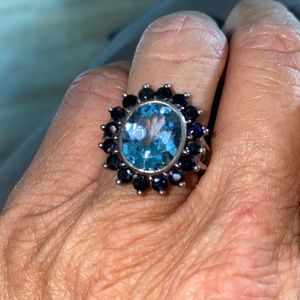 Absolutely stunning sterling silver ring with blue topaz and sapphires. Size 7